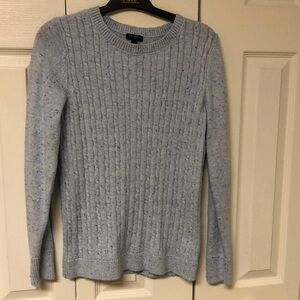 Light blue cable knit sweater.  Photos do not show true baby blue color